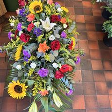 Vibrant large coffin spray 